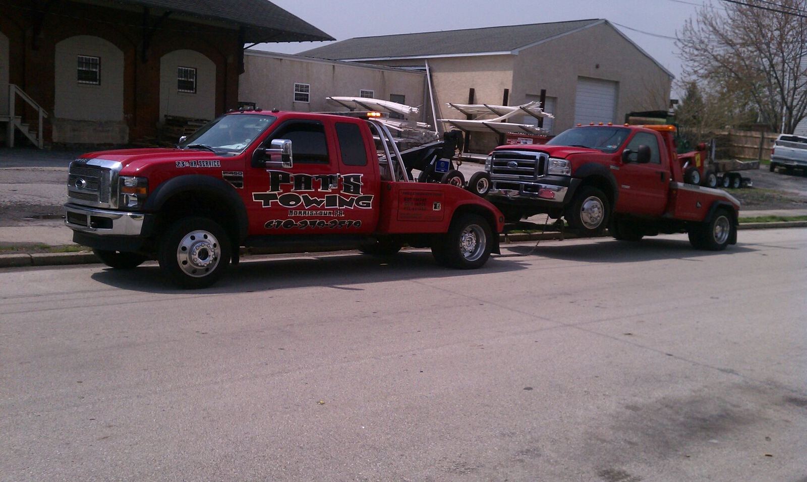 Two Pat's Towing wrecker trucks