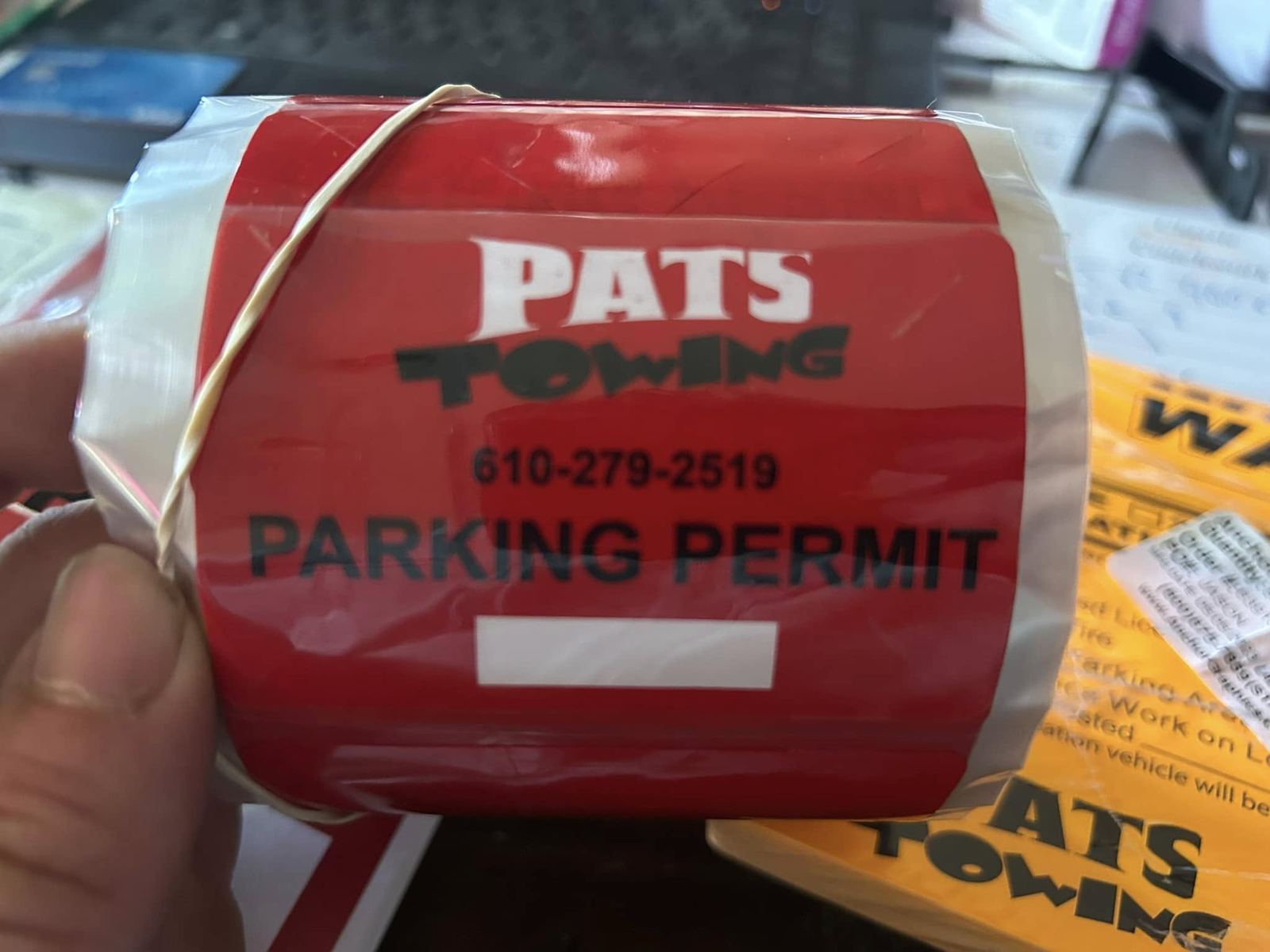 Pat's Towing parking permit stickers
